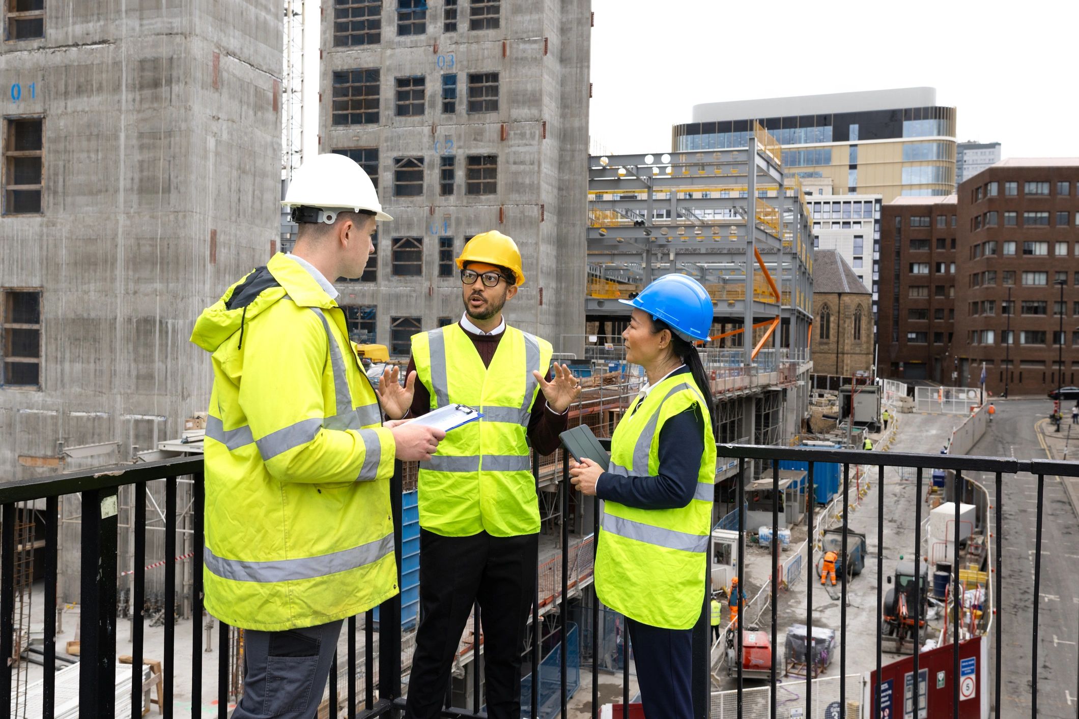 Construction crew discussing plans outdoors