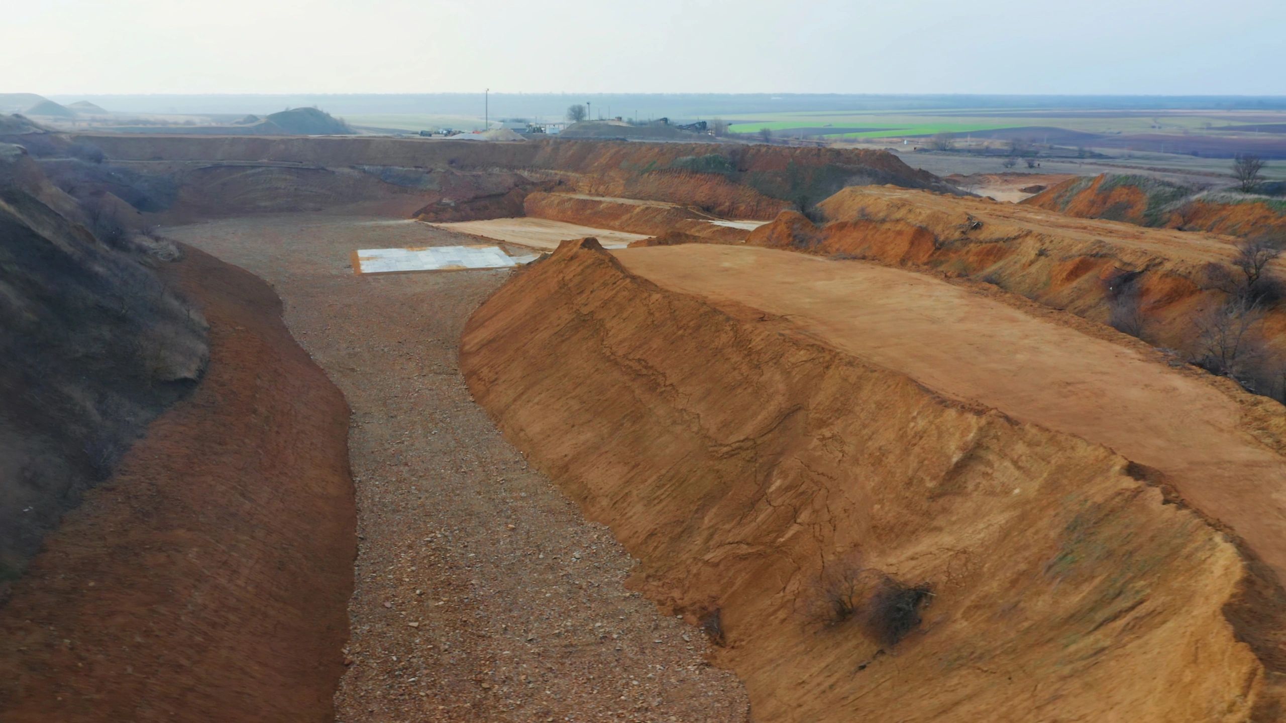 Open-pit excavation site with earthmoving activity