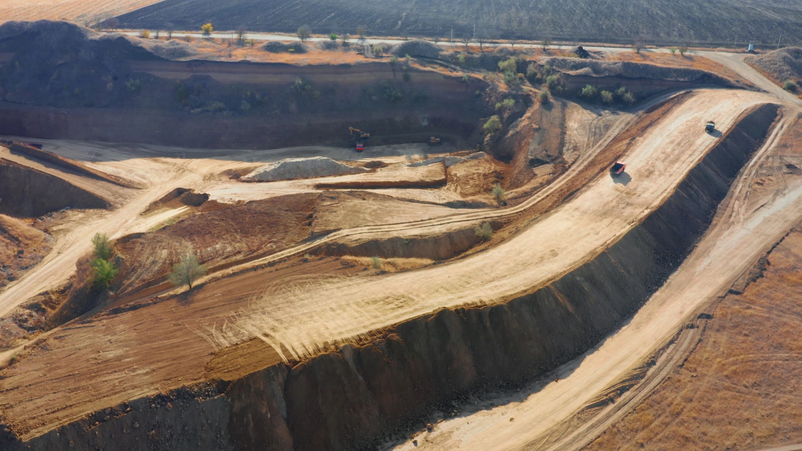 Aerial view of heavy machinery working on an excavation site